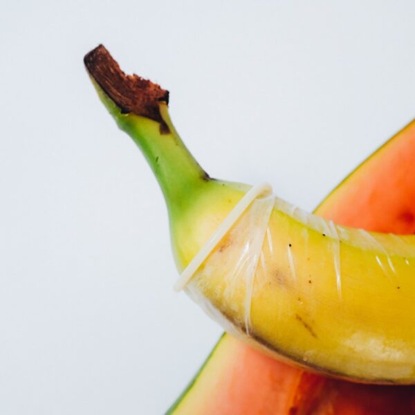 yellow banana fruit on white surface