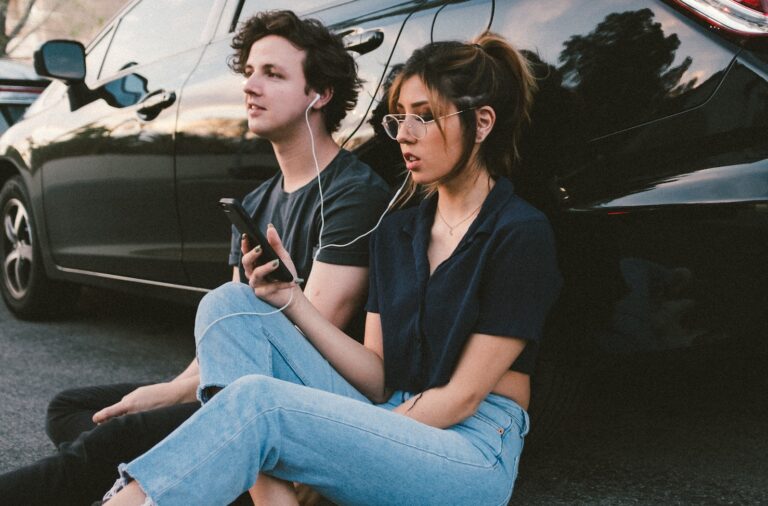 man and woman beside vehicle