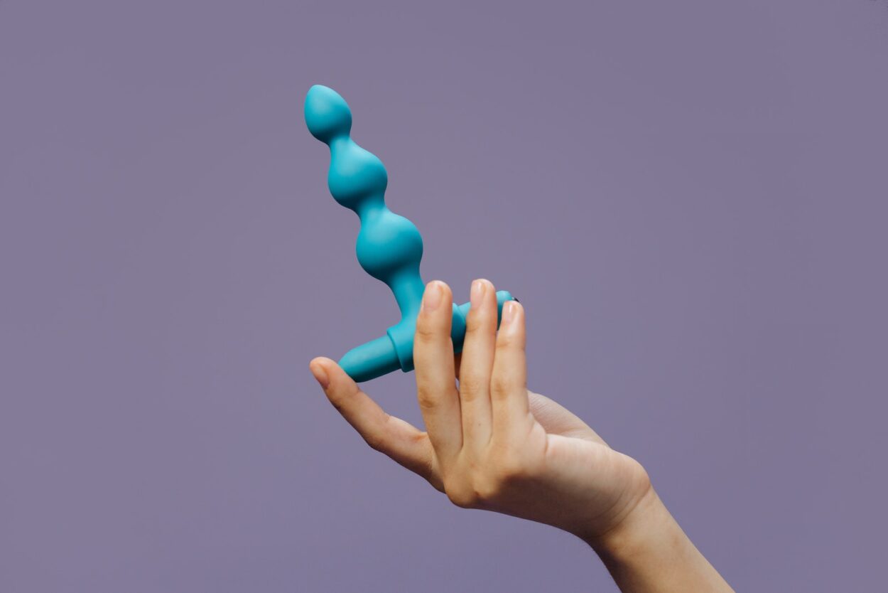 A Person Holding a Sex Toy