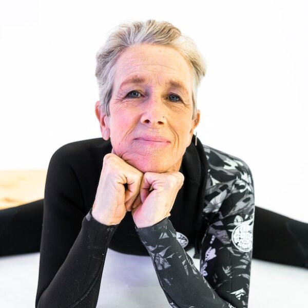 Elderly Woman in Black and White Long Sleeve Shirt Sitting on White Floor