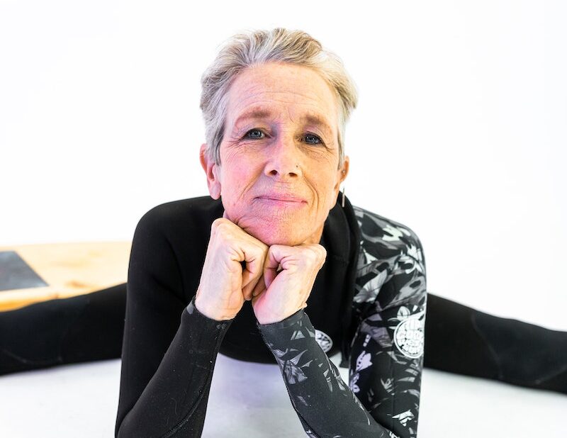 Elderly Woman in Black and White Long Sleeve Shirt Sitting on White Floor