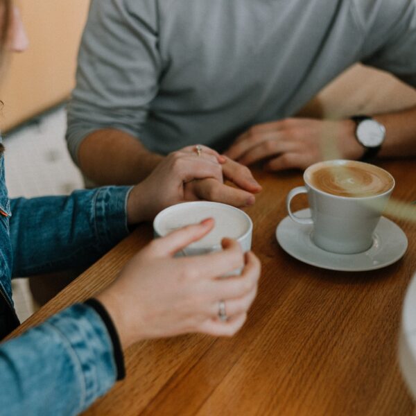 two mugs with coffee on table