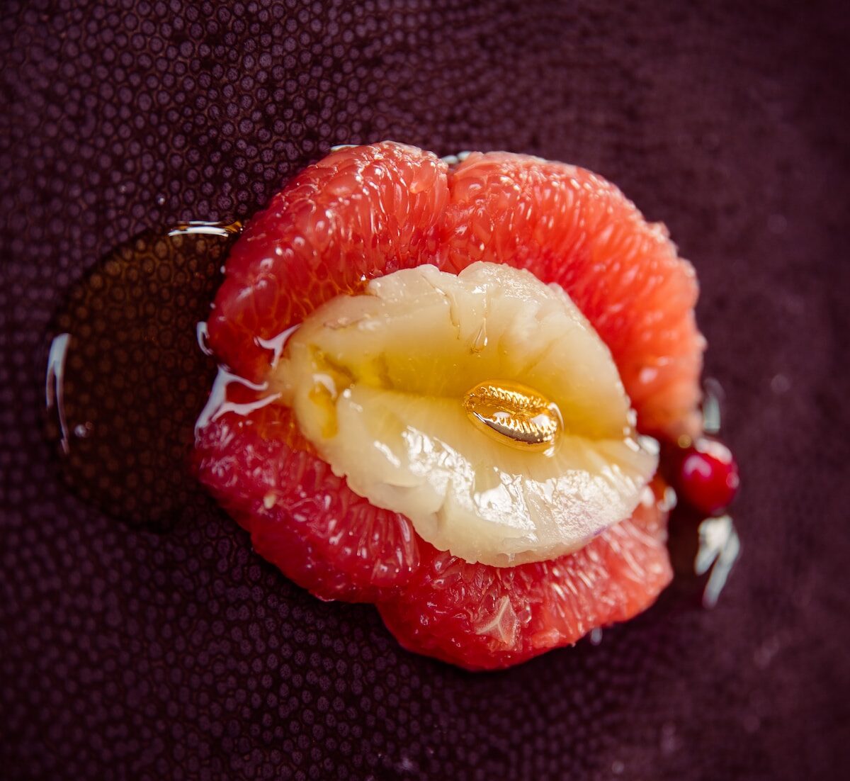 sliced strawberry fruit on black textile